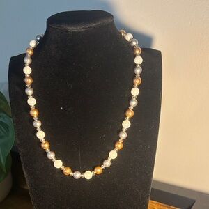 White/gray/brass pearl necklace.